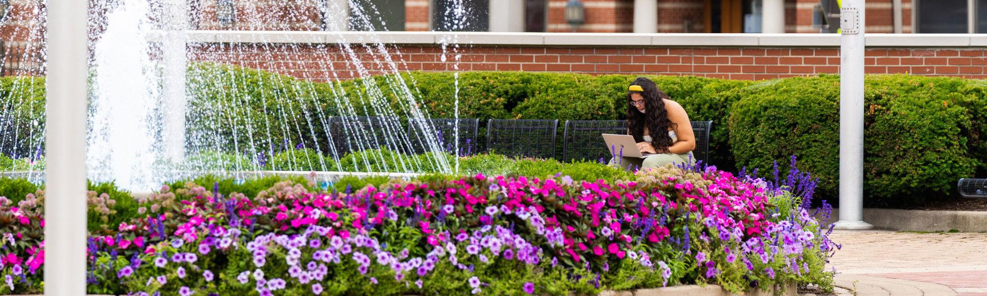 Student studying outdoors.